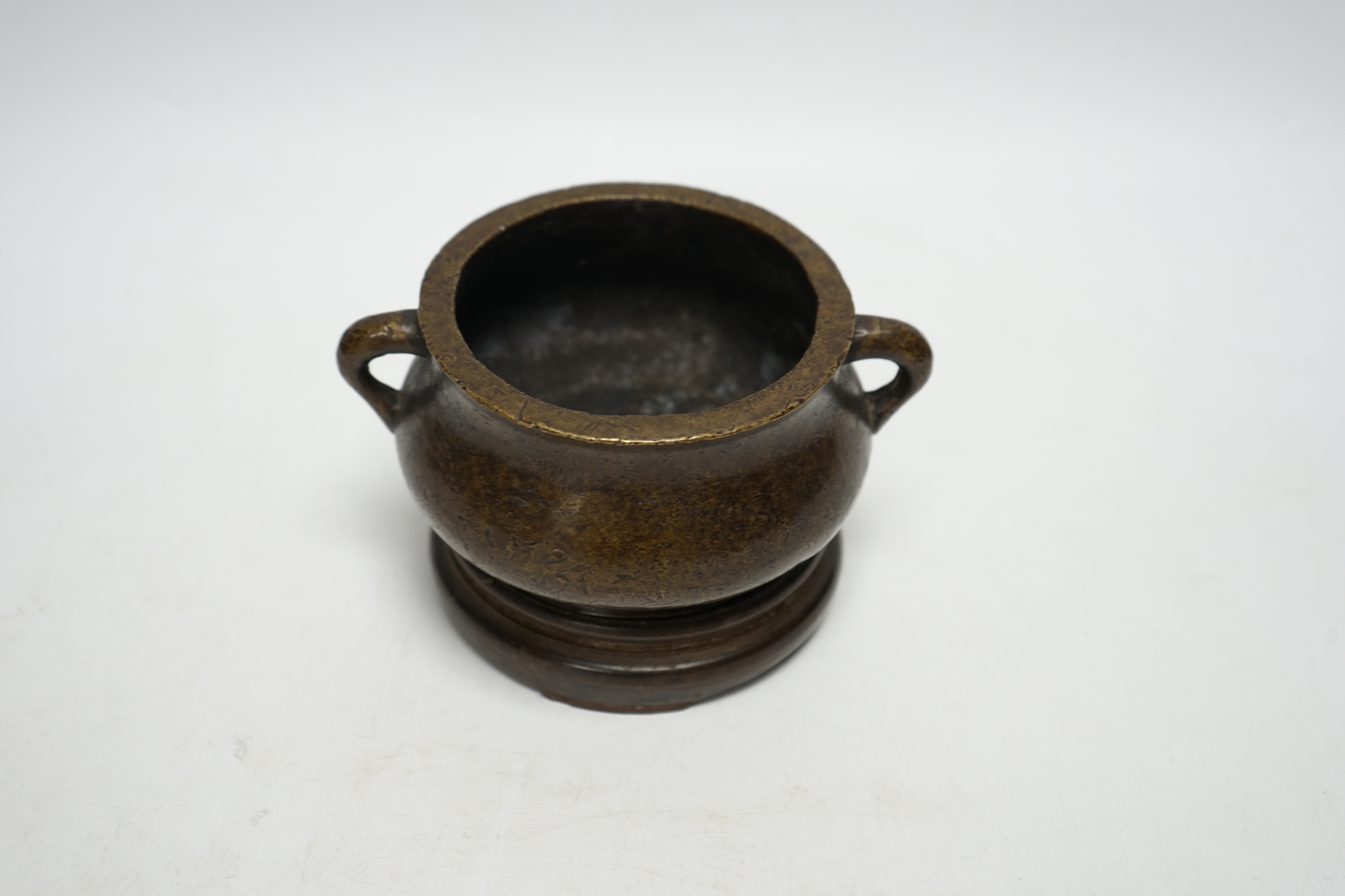 A Chinese bronze censer, Xuande mark, on plinth, 8cm